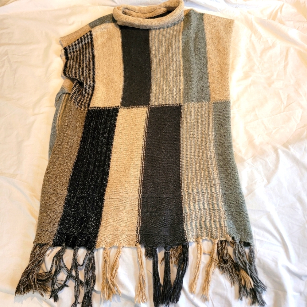 Knit turtleneck fringe poncho